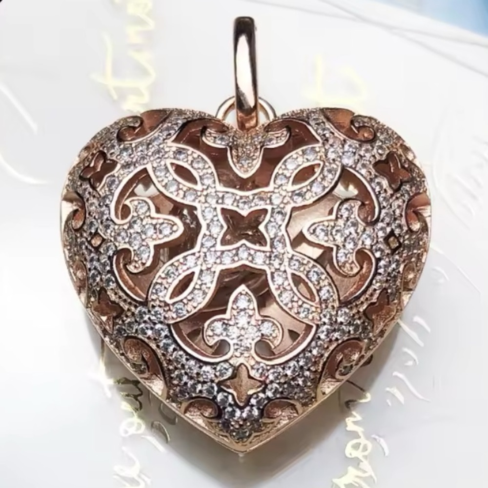 NWOT sterling silver rose gold plated heart locket